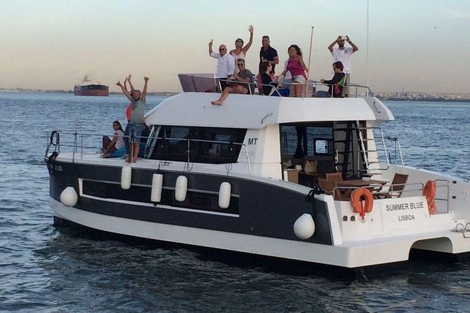 1H power catamaran up to 18 people in Lisbon - The Christ statue across the water