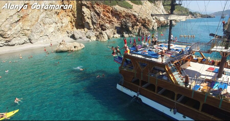Alanya: Catamaran Boat Trip with Swim Stops and Sunbathing - Red Tower and the old shipyard from the water