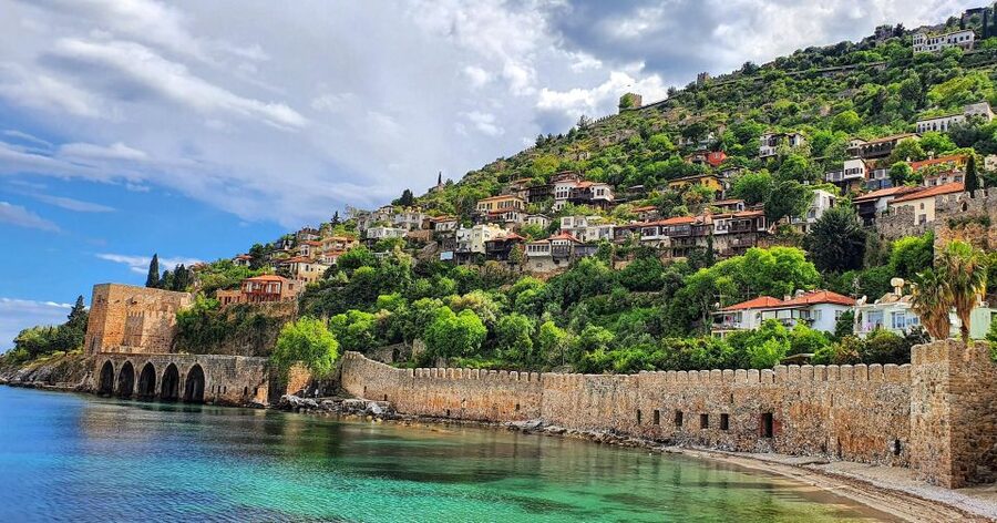 Alanya White Pearl Catamaran Cruise – Scenic Views & Swim - Leaving Alanya Harbor beside the Red Tower