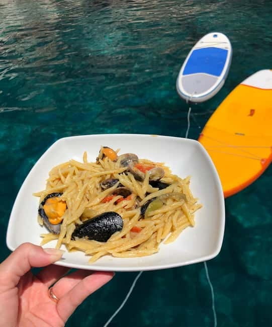 Alghero: Scenic Catamaran Cruise with Lunch and Snorkeling - The afternoon return route and second swim stop