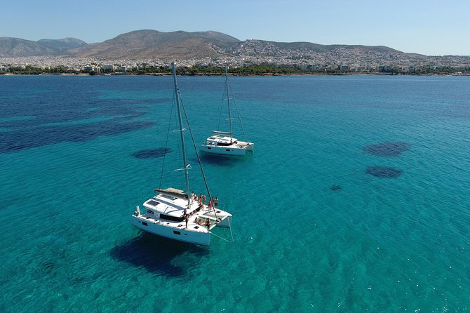 Athens Private Luxury Catamaran Cruise with Traditional Greek Meal and BBQ - Leaving Athens behind on a private catamaran