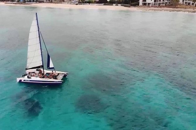 Barbados Catamaran Snorkel Cruise with Lunch and Open Bar - Sailing west with a drink in hand