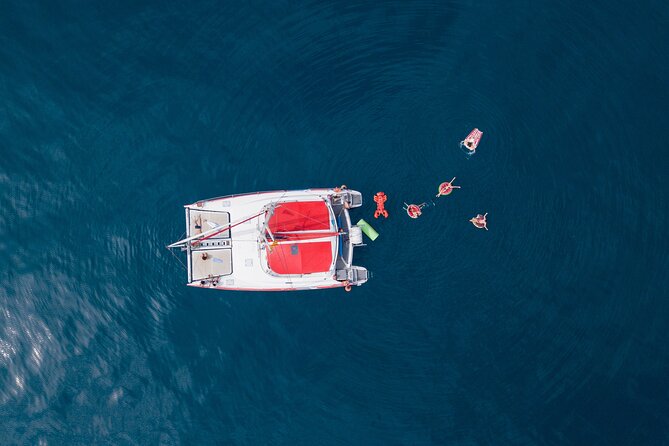 Barcelona Catamaran Cruise with Tapa & Drink Included - Sunset sailing and the city in evening light
