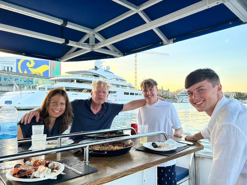 Barcelona: City Views Catamaran Cruise with Music - Port activity, yachts, and skyline views