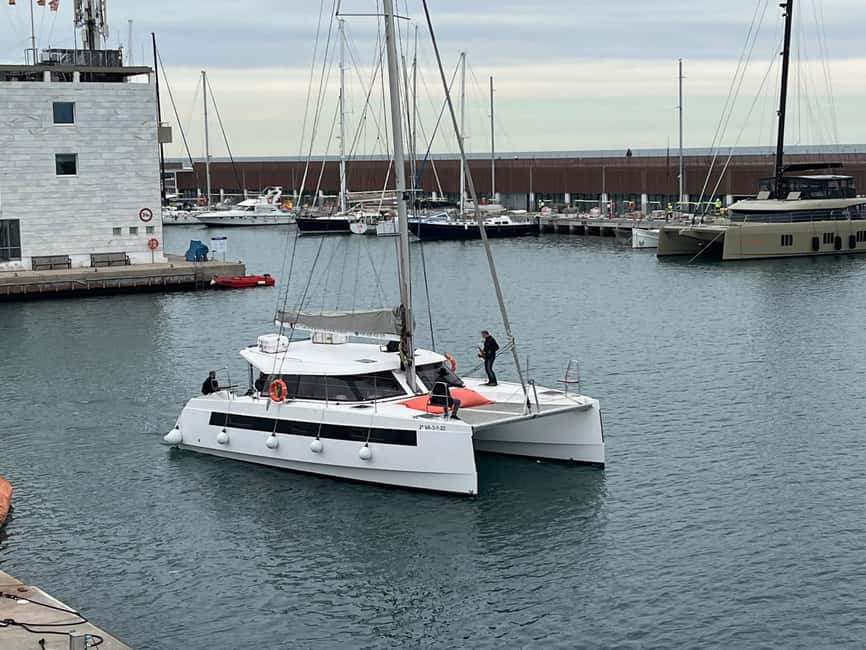 Barcelona: Shared cruise on a catamaran Drink+Local Tapa - La Barceloneta from the water