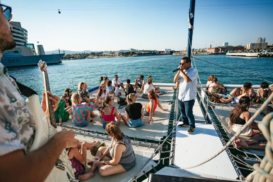 Barcelona: Sunset Catamaran Cruise with Live Music - The nets, seating, and onboard feel
