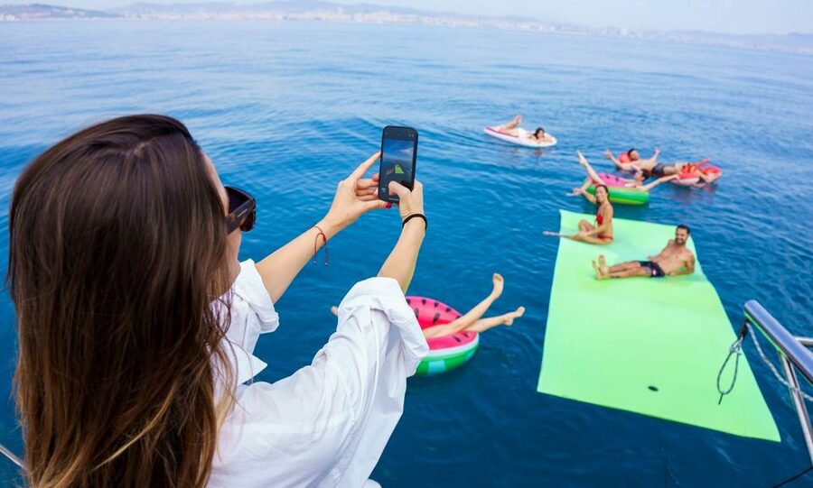 Barcelona: Sunset or Day Catamaran Cruise with Tapa & Drink - The daytime route and its 30-minute swim stop