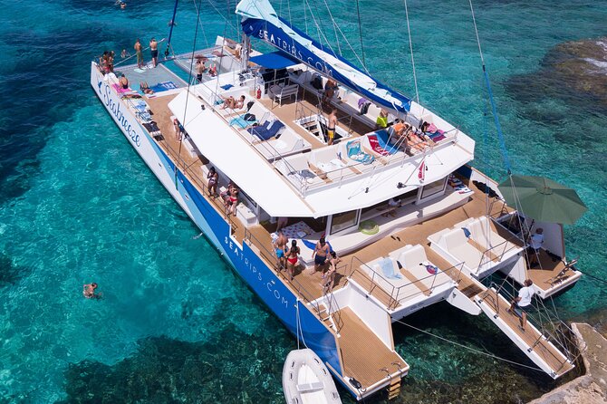 Blue Lagoon, Beaches and Bays Catamaran Sailing Tour - Ghajn Tuffieha, Mellieha Beach, and Ramla Bay