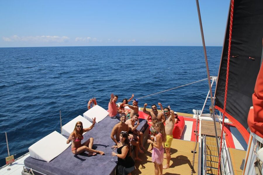 Cambrils: Catamaran Day Cruise with BBQ and Drinks - A floating beach club off the Cambrils coast