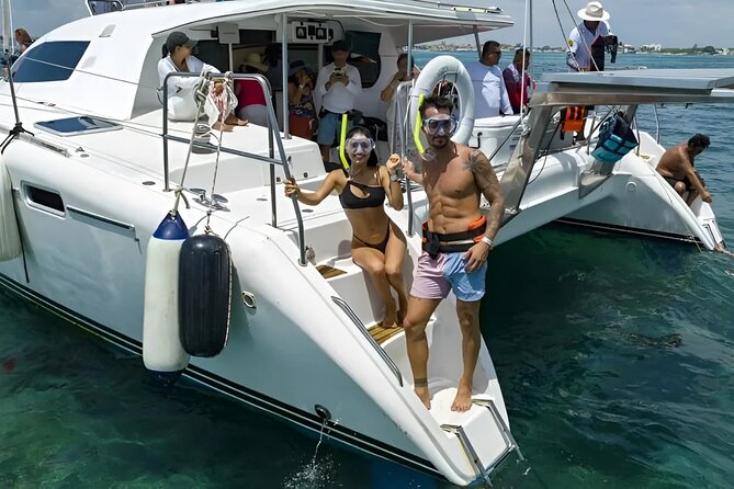 Cancun Catamaran: Sail to Isla Mujeres + Buffet & Drinks - The snorkeling stop and what is included