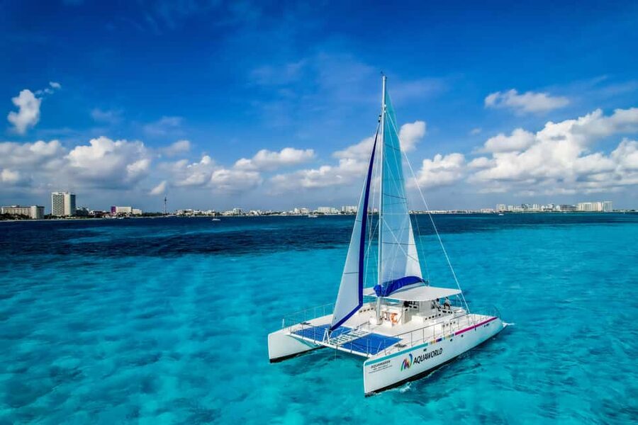 Cancun: Isla Mujeres Catamaran Ride, Open Bar & Buffet Lunch - Snorkeling the reef before lunch