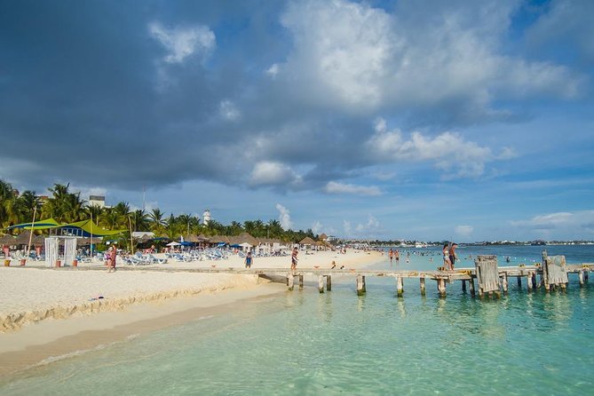 Catamaran adventure to Isla Mujeres with Snorkel,Buffet,Open Bar and Beach Club - Weather can change the day completely