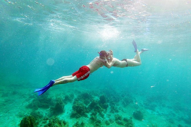 Catamaran Cruise Full Day Tour to Reef, Caves and Negril Beach - Boarding the catamaran means getting wet