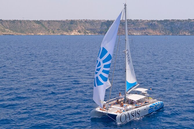Catamaran sailing at sunset with tapas Palma de Mallorca - Returning past Palma Cathedral