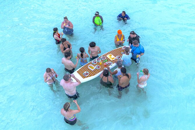 Catamaran Snorkeling to El Cielo and The Money Bar Beach Club - Palancar Reef with a guide in the water