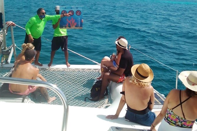 Catamaran to Isla Mujeres, Open bar, buffet, Beach Club Included - Crowds, shade, and the party atmosphere