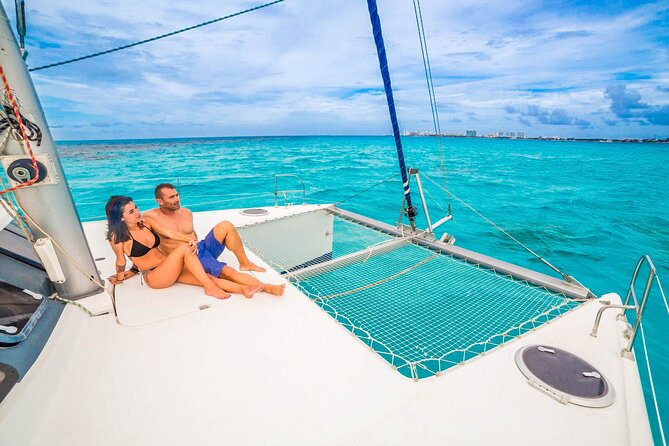 Catamaran to Isla Mujeres Snorkeling Tour with Open Bar and Lunch - The return sail and sunset expectations