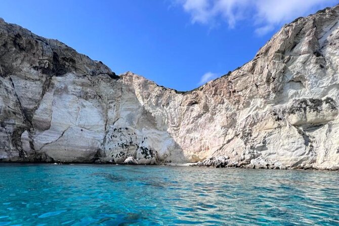 Catamaran tour stops bathing and snorkeling toast with prosecco - Cala Fighera and Grotta dei Colombi