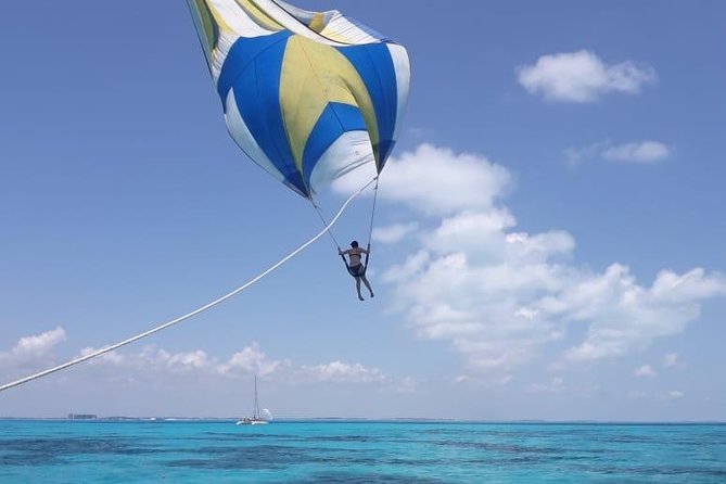 Catamaran Tour to Isla Mujeres from Cancun or Riviera Maya - Snorkeling in the clear Caribbean water