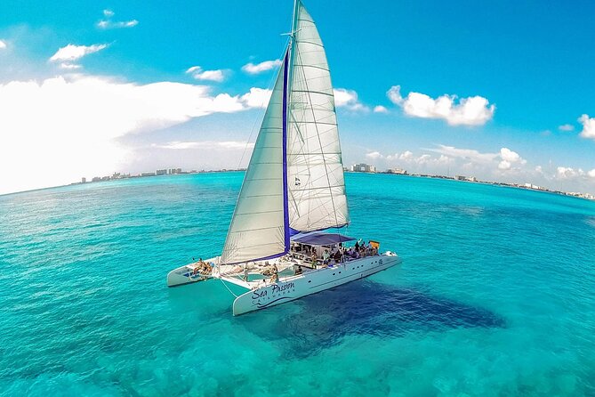 Catamaran Tour to Isla Mujeres from Cancún with Bar and Lunch - Beach-club time, lunch, and a quieter pause
