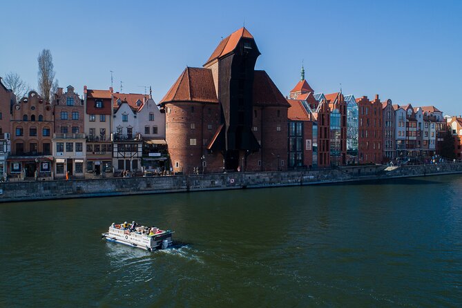 Cruises on the Motlawa River by a luxury catamaran - Gdańsk from the water side - SS Soldek and the working river