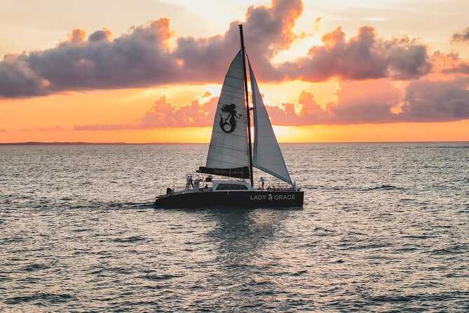 Deluxe Sunset and Saxophone Sail on Luxury Lady Grace Catamaran - A polished sunset start at The Ritz-Carlton beach