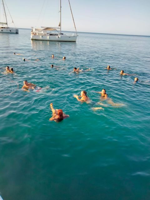Denia: Cova Tallada Catamaran Tour and Swimming Stop - The drink, music, and time on deck