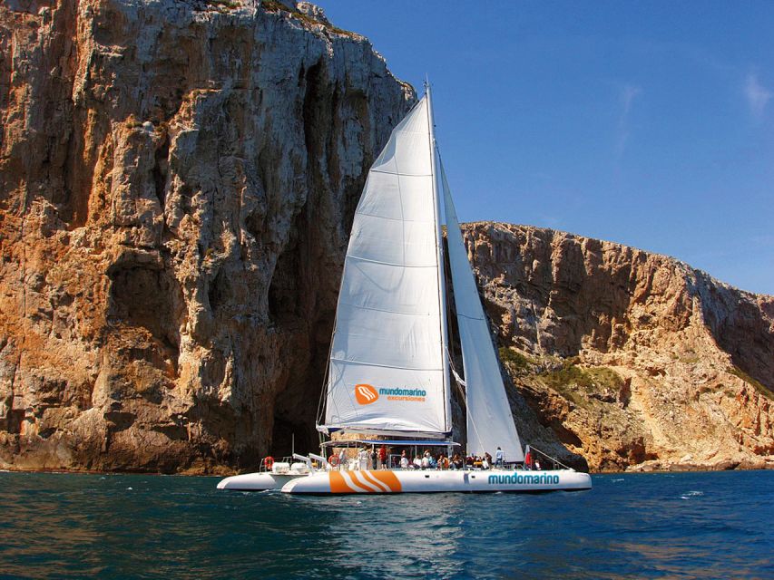 Dénia & Jávea: Portixol Sailing Catamaran Excursion with BBQ - Coastline views from the catamaran