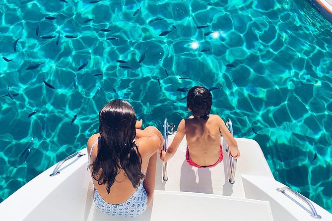 Discover Cala Bassa and Cala Comte on board a catamaran - Beach clubs, sunset, and the return to Sant Antoni