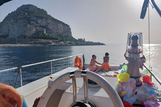 Discovering Cefalù's Coastline Activity on a Mini Catamaran - What the $47.40 price means