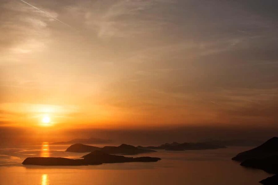 Dubrovnik: Sunset Catamaran Cruise with Sparkling Wine - Dubrovnik Old Town harbor is the opening scene