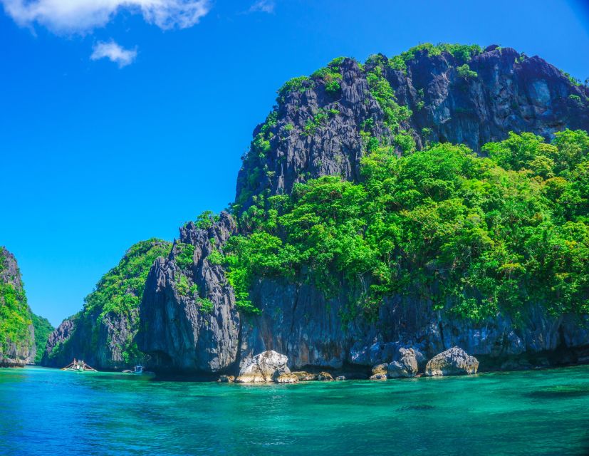 El Nido: Full-Day Premium Island Hopping Catamaran Cruise - Snorkeling, swimming, and kayaking