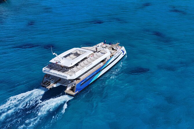 Experience the Malta fireworks festival from a catamaran - Sailing Past St Julians and Sliema