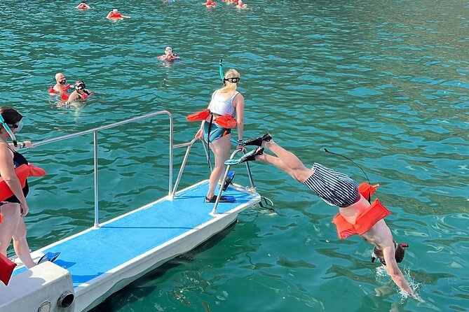 Flamingo Family Fun Catamaran Snorkel:Comfortable shaded seating - Sunset, music, and the ride back