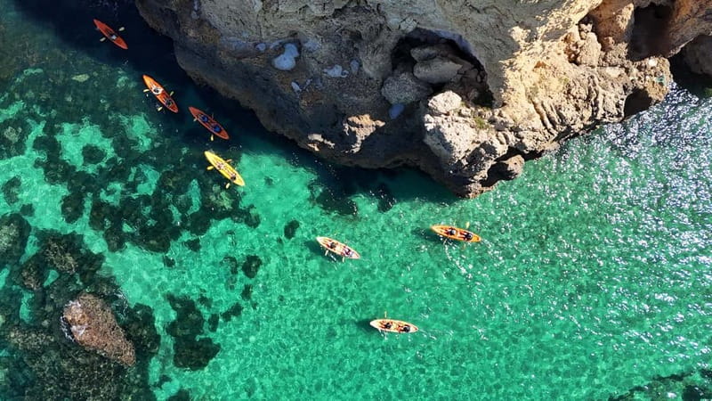 From Lagos: Ponta da Piedade Caves Kayak Tour from Catamaran - Sliding into a double kayak