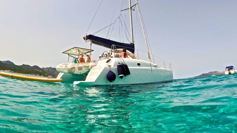 From Olbia: Tavolara or Cala Moresca Catamaran Tour - Swimming stops and two SUP boards