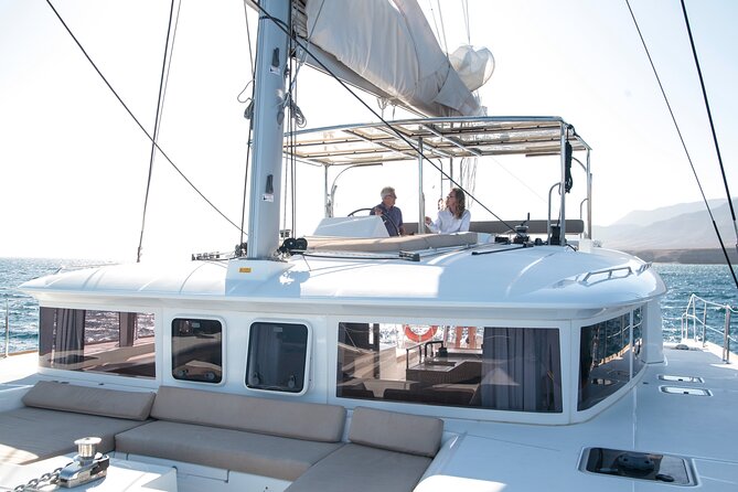 Fuerteventura: Small-Group Magic Deluxe Catamaran Cruise - Coastal sailing beside Fuerteventura’s volcanic shore
