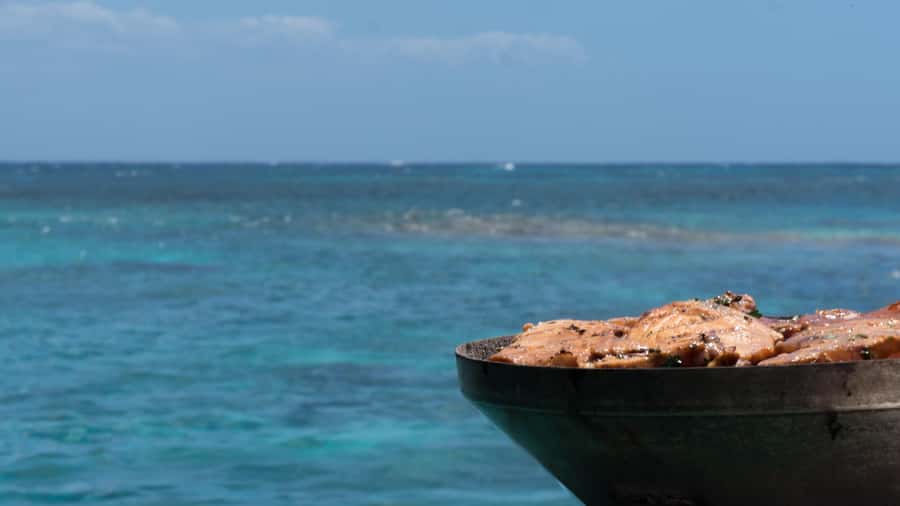 Full Day Catamaran Luxury Cruise to Northern Islands w Lunch - Gunners Coin: a sharp rock wall from the sea
