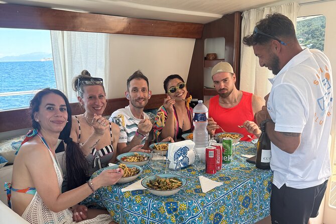 Full-day catamaran tour in Palermo: boat experience with lunch - Food, drinks, music, and the feel on board
