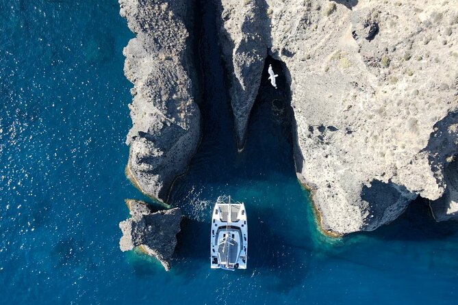 Full-Day Private Tour in Santorini by Luxury Catamaran - Akrotiri Lighthouse and Black Mountain from the sea