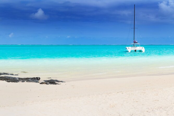 Full Day Shared Tour Catamaran to Ile Aux Cerfs - Starting the day with a hotel pickup and river departure