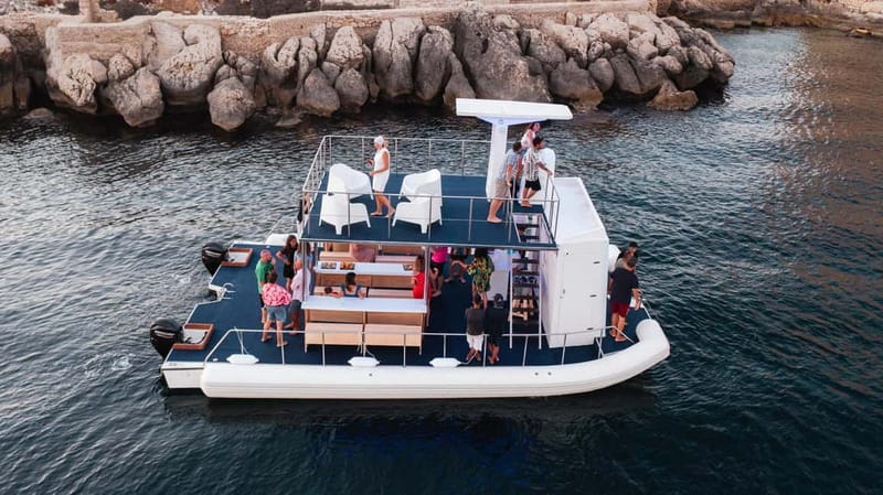 Giardini Naxos: Dolphin Catamaran Sunset Tour with Aperetif - Sailing out of Giardini Naxos at sunset