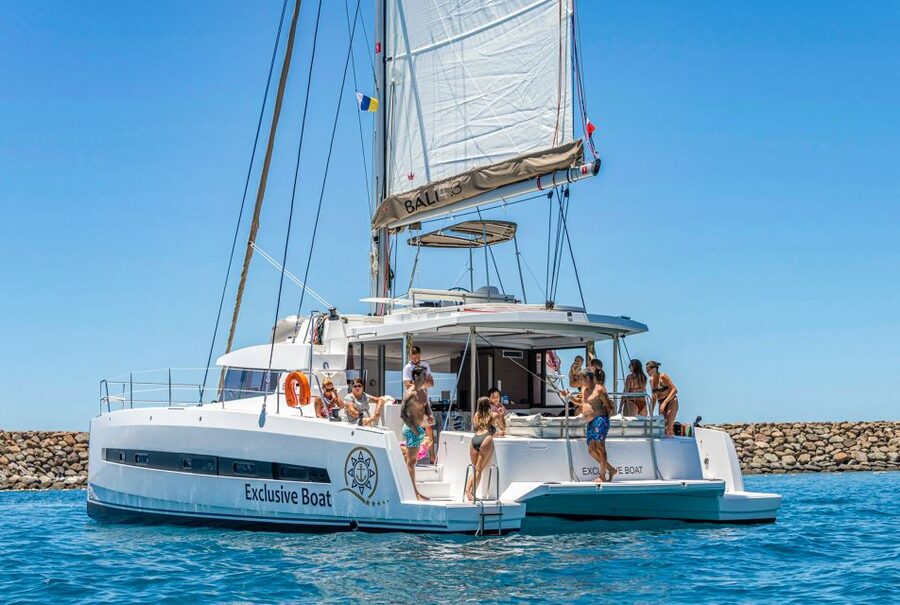 Gran Canaria: Catamaran Day Trip with Food and Drinks - First stop: swimming, snorkeling, kayaking, and SUP