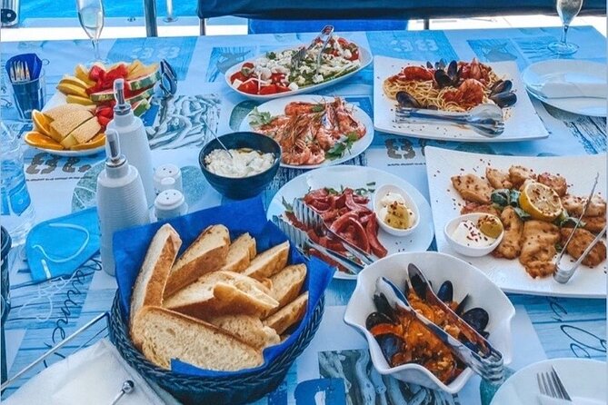 Half-Day Exclusive Catamaran Cruise in Santorini with Meal and Open Bar - The volcano and hot springs stop