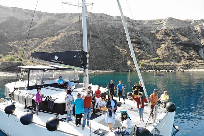 Half-Day Exclusive Catamaran Cruise in Santorini with Meal and Open Bar - The crew shapes the day