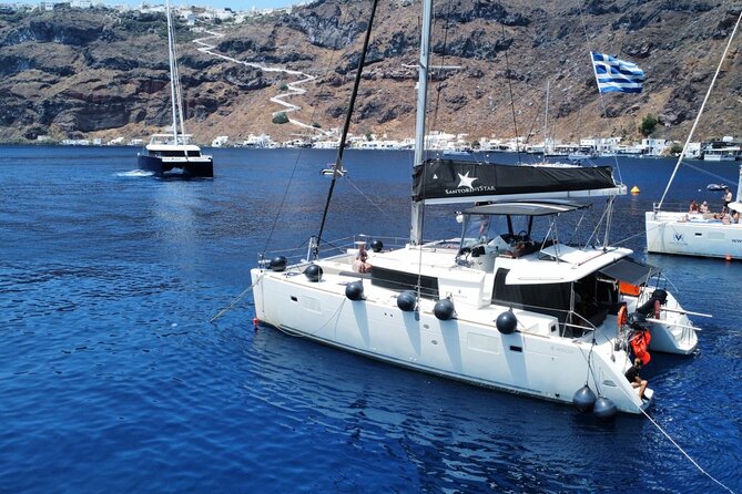 Half Day Premium Catamaran Cruise in Santorini including Oia - Red Beach, seen from the sea