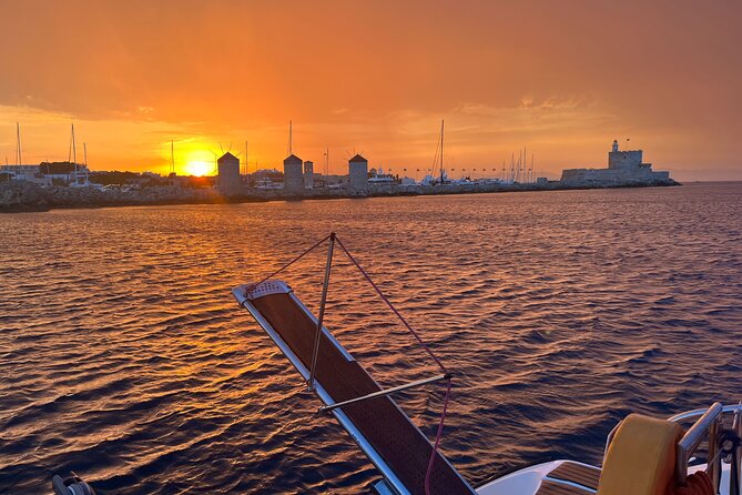 Half Day Sailing Catamaran with Sunset Experience - Watching sunset in front of medieval Rhodes