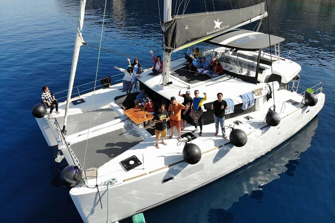 Half-Day Tailor-made Private Catamaran Cruise in Santorini - Swimming in clear water between the landmarks