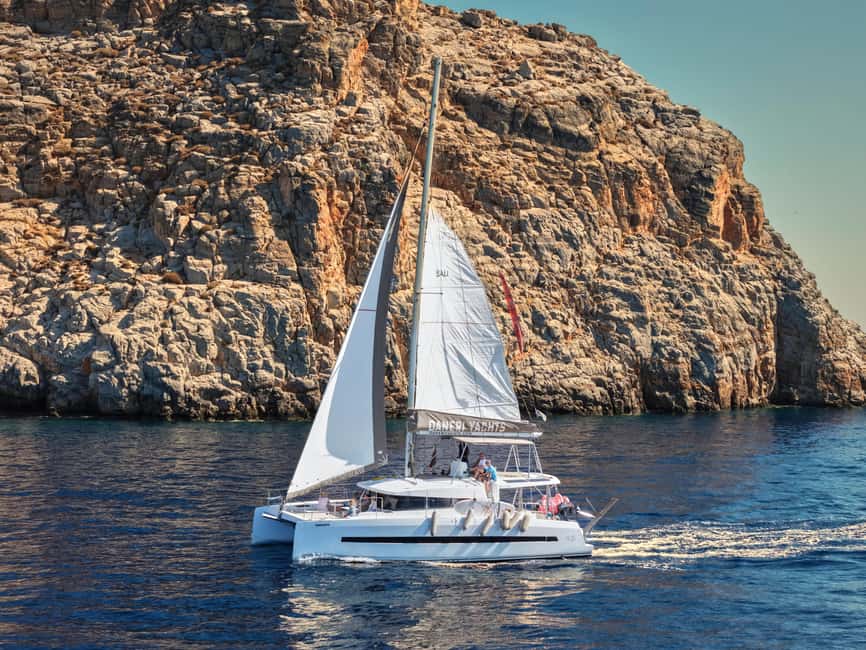 Hersonissos: Dia Catamaran Cruise with Lunch & Drinks - Leaving Hersonissos on a comfortable catamaran