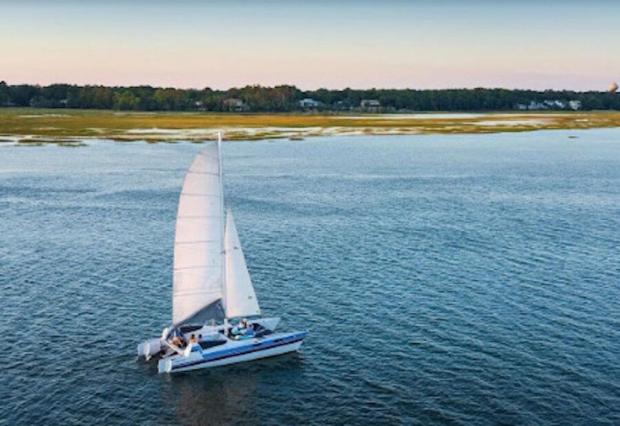 Hilton Head: Private Dolphin Day or Sunset Catamaran Sail - Daytime sailing, sunset light, or fireworks after dark
